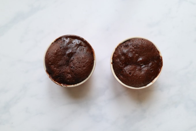 the cooked mug cakes out of the microwave