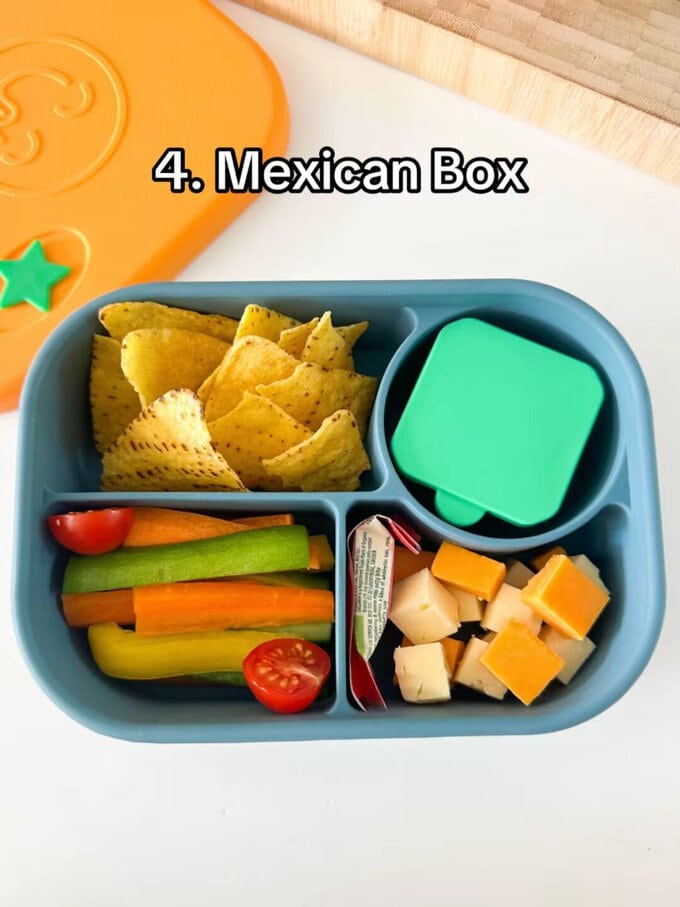 Mexican Style lunch served in a kids blue, bento style lunchbox with a dip pot.